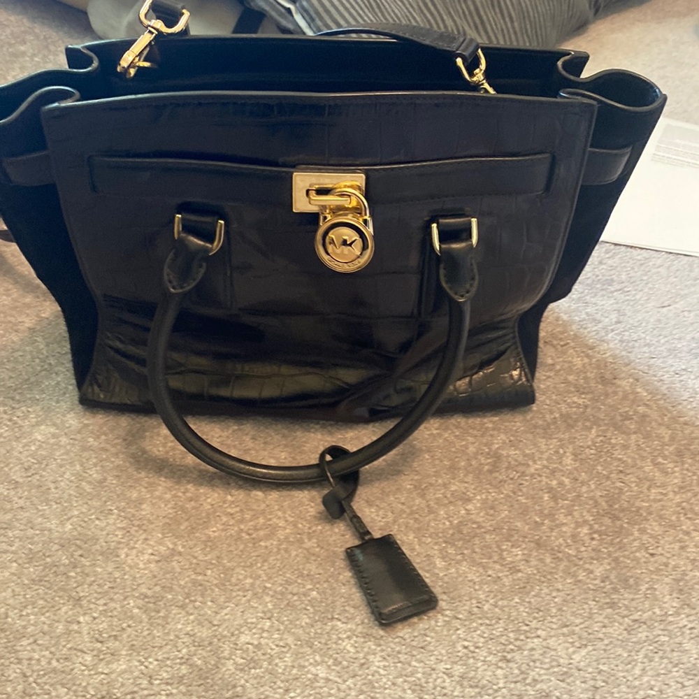 Black Michael Kors snake skin travel back barely used very good condition.